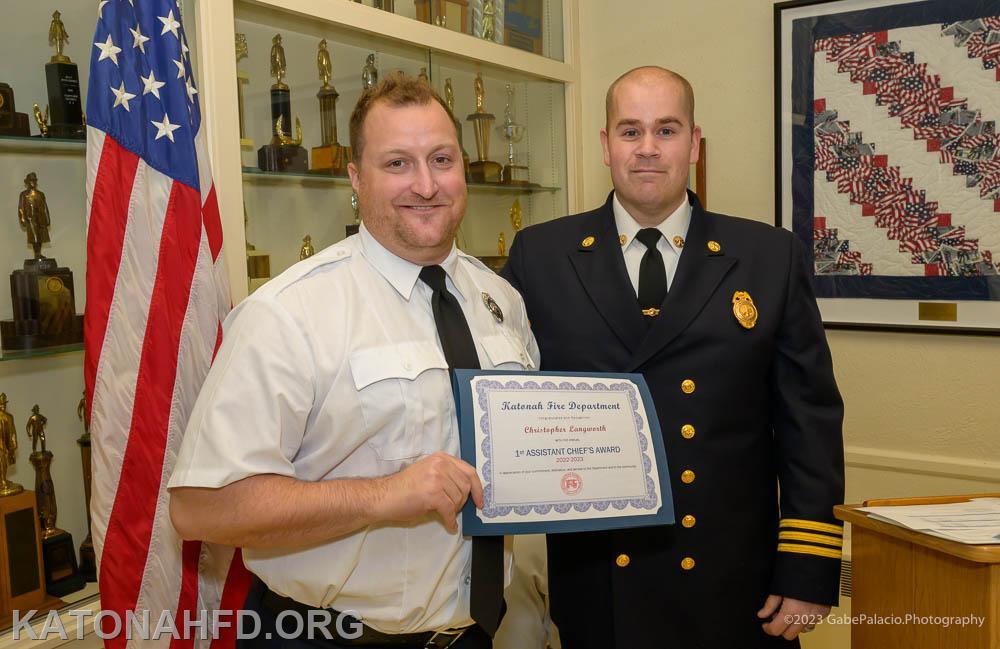 The First Assistant Chief's Award, presented by John Whalen, right, went to Firefighter Chris Langworth. Photo by Gabe Palacio.